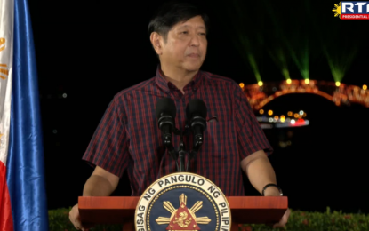 <p><strong>LIGHTING PROJECT.</strong> President Ferdinand R. Marcos delivers a message after he formally switched on the San Juanico Bridge aesthetic lighting project on Wednesday night (Oct. 19, 2022). The project was conceptualized in 2017 by the local government as part of its Spark Samar tourism campaign. <em>(Screengrab from RTVM)</em></p>