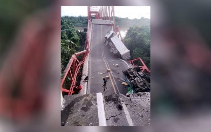 <p><strong>OVERLOADING</strong>. A portion of the Carlos P. Romulo Bridge in Barangay Wawa Bayambang town, Pangasinan on Thursday (Oct. 20, 2022). The Department of Public Works and Highways (DPWH) confirmed on Friday that the collapse of the bridge was due to overloading. <em>(Photo courtesy of Bayambang PDRRMO/ Aries Bautista)</em></p>