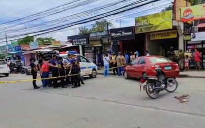<p><strong>CRIME SCENE.</strong> Police conduct a post-crime investigation at the site where Cotabato City village councilman Alberto Tampos, 43, was shot dead Thursday (Oct. 20, 2022) along Governor Gutierrez Avenue, Cotabato City. The victim died on the spot.<em> (Photo courtesy of Ferdinandh Cabrera)</em></p>