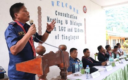 <p><strong>DIALOGUE.</strong> Police Regional Office - Cordillera deputy director for operations Col. Ronald Gayo (left) leads the discussion during a dialogue among representatives of various government agencies, as well as local officials and elders, in Tinglayan, Kalinga on Oct. 20, 2022. The dialogue was part of efforts to end the long-standing issue of marijuana cultivation in the town. <em>(PNA photo courtesy of PROCOR PIO)</em></p>