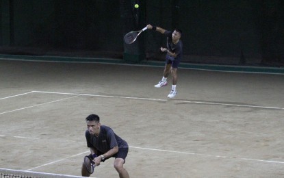 <p><strong>GOOD START.</strong> Philippine Army's Jeson Patrombon and Elbert Anasta hurdle first-round match against Mapua's Marco Makalintal and Gabriel Guria in the 39th Philippine Columbian Association (PCA) Tennis Championships men's doubles category at the PCA indoor shell court in Plaza Dilao, Paco, Manila on Sunday (Oct. 23, 2022). They won, 6-1, 6-4. <em>(PNA photo by Joseph Razon)</em></p>