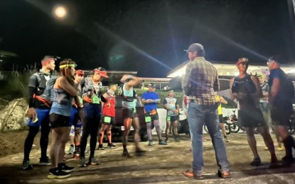 <p><strong>SPORTS TOURISM.</strong> Race director Romualdo Calbes (back to the camera) briefs participants before the start of the 1st Matanao Mountain Marathon in Davao del Sur on Saturday (Oct. 22, 2022). Featuring 59 runners in the 42 and 21 kilometer categories, the race showcased Matanao’s caves, waterfalls, and scenic peaks and ridges. <em>(Courtesy of Radyo Pilipinas Davao)</em></p>