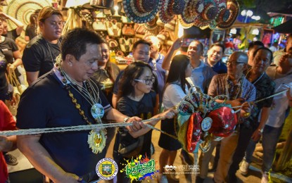 <p><strong>BUGLASAN FEVER</strong>. Negros Oriental Gov. Roel Degamo leads the opening of the fair booths on Sunday evening (Oct. 23, 2022) at the capitol grounds as part of the Buglasan Festival. Health authorities hoisted a Code White Alert in Negros Oriental from Oct. 21 to Nov. 3 to prevent the transmission and spread of diseases during the festivities and the observance of "Undas." <em>(Photo courtesy of the Capitol PIO)</em></p>