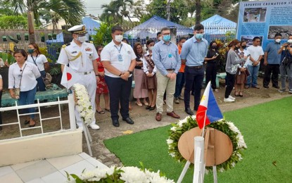 <p><strong>FALLEN SOLDIERS.</strong> Mayor Pablo Yves Dumlao (2nd from left) and Commander Sekine Takeharu (left), the Vice Defense Attaché of the Embassy of Japan in the Philippines, lead the wreath-laying ceremony at the Cremation Site inside the campus of Surigao del Norte National High School in Surigao City on Monday (Oct. 24, 2022) to honor the more than 500 Japanese soldiers and Navy personnel who died during World War II in the area. The ceremony was among the highlights of the commemoration of the 78th year anniversary of the Battle of Surigao Strait that took place on Oct. 25, 1944. <em>(PNA photo by Alexander Lopez)</em></p>