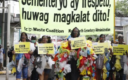 <p><strong>TRASH-FREE 'UNDAS'</strong>. EcoWaste Coalition members and Metropolitan Manila Development Authority personnel, some of whom are dressed as “Zombasuras” (cemetery litterbugs), call for an eco-friendly and waste-free observance of Undas at the Manila North Cemetery on Tuesday (Oct. 25, 2022). This is in anticipation of the massive influx of visitors in cemeteries, memorial parks, and columbaria, which results in piles of trash being left in these areas during the observance of Undas. <em>(PNA photo by Alfred Frias)</em></p>