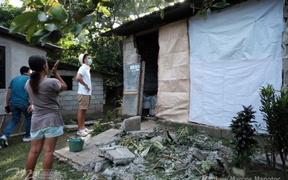 <p><strong>DAMAGED</strong>. Ilocos Norte Governor Matthew Joseph Manotoc inspects a damaged house in Barangay Saud, Badoc, Ilocos Norte on Wednesday (Oct. 26, 2022). He pledged to provide materials for housing while labor will be provided by the Badoc municipality. <em>(Photo courtesy of the Provincial Government of Ilocos Norte)</em></p>