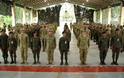 <p><strong>WARFARE DRILLS.</strong> Officials of the Philippine Army's First Scout Ranger Regiment (FSRR) and the 3rd Royal Australian Regiment (3RAR) pose for a photo opportunity during the closing rites of the "Exercise Kasanggga" at Camp Pablo Tecson, San Miguel, Bulacan on Oct. 25, 2022. The Philippine Army on Thursday (Oct. 27), 2022 said the bilateral exercise bolstered defense ties and strengthened interoperability between the two armies in urban and jungle operations. <em>(Photo courtesy of Philippine Army)</em></p>