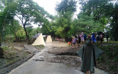 <p><strong>BROKEN BRIDGE.</strong> A footbridge in Barangay Mantuyop, Siaton town in Negros Oriental is cut in half as flash floods triggered by Tropical Storm Paeng inundate several areas Friday (Oct. 28, 2022). The footbridge is among several infrastructure damaged by flash floods in the region. <em>(Photo courtesy of the 11th Infantry Battalion of the Philippine Army)</em></p>
