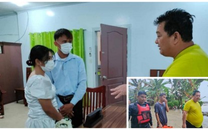 <p><strong>THE WEDDING MUST GO ON.</strong> Mayor Juanito Agustin of Pigcawayan, North Cotabato (right), officiates a wedding of his constituents soaked in floodwater on Friday (Oct. 28, 2022). He took a break from his rescue missions to administer the civil wedding at the town hall. <em>(Photo courtesy of Pigcawayan LGU)</em></p>