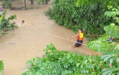 <p><strong>RESCUE</strong>. Responders conduct a rescue operation in Barangay Dumarao, Capiz following the flooding due to tropical storm Paeng on Friday (Oct. 28, 2022). The province of Capiz is one of most-affected areas in Western Visayas by the tropical storm, according to Cindy Ferrer, spokesperson for the Regional Disaster Risk Reduction and Management Council in an interview.<em> (Photo courtesy of MDRRMO Dept. FB)</em></p>