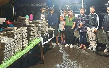 <p><strong>DRUG HAUL</strong>. The 204 marijuana bricks, valued at PHP24.7 million, seized by government anti-illegal drugs law enforcers at a checkpoint in Lubuagan, Kalinga on Friday evening (Oct. 28, 2022). Regional police director, Brig. Gen. Mafelino Bazar, said on Saturday (Oct. 29, 2022) three suspects (left) were arrested as they attempted to transport the marijuana from Tinglayan but were intercepted based on tips from an informant. <em>(Photo from PROCOR PIO)</em></p>