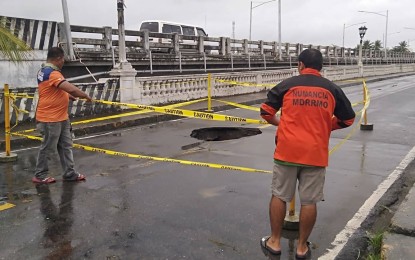 <p><strong>DAMAGED</strong>. The old Kalibo Bridge is temporarily closed to traffic after it was damaged. A bridge parallel to it is being used as an alternative route, said Aklan Provincial Disaster Risk Reduction and Management Officer Galo I. Ibardolaza, in an interview on Saturday (Oct. 29, 2022). <em>(Photo courtesy of Numancia Municipal Disaster Risk Reduction and Management Office)</em></p>
