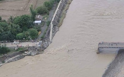 <p><strong>DOWN.</strong> Aerial shot of the damaged Paliwan Bridge that connects the towns of Laua-an and Bugasong in Antique during an inspection on Sunday (Oct. 30, 2022). Two roads and five other bridges remained impassable in the province, damaged by Tropical Storm Paeng. <em>(Courtesy of Province of Antique Facebook)</em></p>