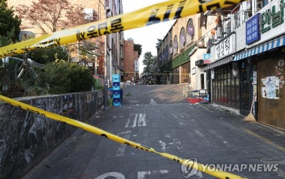 <p>A small street in Itaewon is cordoned off on Oct. 30, 2022, a day after a deadly crowd crush in the popular nightlife district killed more than 150 people during Halloween celebrations. <em>(Yonhap)</em></p>