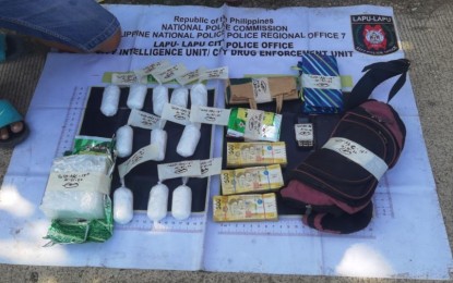 <p><strong>DRUG HAUL.</strong> Packs of suspected shabu and marked money seized from the drug suspects in separate operations in Cebu province. Police arrested four drug suspects and seized about PHP50 million worth of illegal drugs. <em>(Photo courtesy of PRO-7)</em></p>