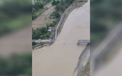 <p><strong>DOWN.</strong> Aerial view of the damaged Paliwan Bridge that connects the towns of Laua-an and Bugasong in Antique during an inspection on Sunday (Oct. 30, 2022). Two roads and five other bridges remained impassable in the province due to Severe Tropical Storm Paeng. <em>(Courtesy of Province of Antique Facebook) </em></p>
