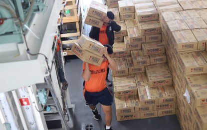 <p><strong>FAMILY PACKS.</strong> Workers of the Philippine Coast Guard carry family packs from the Department of Social Welfare and Development aboard BRP Melchora Aquino on Wednesday (Nov. 2, 2022). The vessel will deliver the relief supplies to families in Iloilo province affected by the recent onslaught of Severe Tropical Storm Paeng. <em>(Photo courtesy of PCG)</em></p>