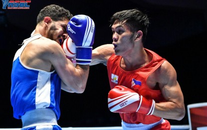 <p><strong>RIGHT HOOK.</strong> James Palicte of the Philippines (right) connects with a crisp right hook to his Iraqi opponent Jaafar Abdulreal Sudani in the 2nd round of their light welterweight match in the Asian Elite Championships in Amman, Jordan on Wednesday (Nov. 2, 2022). Palicte’s teammate Mario Fernandez, however, lost a close 3-2 decision to the host country’s Yousef Iashash in their featherweight match. <em>(Photo courtesy of ASBC)</em></p>