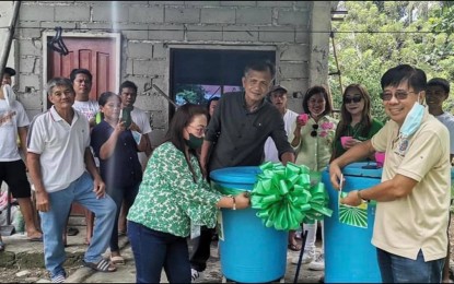 <p><strong>POTABLE WATER.</strong> Members of Pamilyang Malahutayong Mag-uuma sa Tambac Association in Barangay Tambac, Tulunan, North Cotabato, witness the turnover of a water project from the Department of Agrarian Reform (DAR) that gives them safe drinking water. DAR said Thursday (Nov. 3, 2022) the project will benefit 70 households, including neighboring areas. <em>(Photo courtesy of DAR-North Cotabato)</em></p>