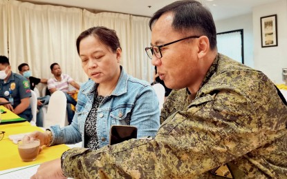 <p><strong>COLLABORATION.</strong> Department of the Interior and Local Government-Negros Oriental Director Farah Gentuya and Brig. Gen. Leonardo Peña discuss security concerns during the two-day Peace and Order and Public Safety (POPS) Plan meeting on Thursday and Friday (Nov. 3-4, 2022). Peña said soldiers are continuously monitoring the movement of rebels following the recent encounters in Guihulngan City and the clashes late October in Himamaylan City. <em>(Photo by Judy Flores Partlow)</em></p>