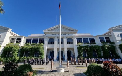 <p><strong>FLAG CEREMONY</strong>. The Philippine flag is hoisted in front of the Provincial Capitol building on Monday (Nov. 7, 2022) while government employees sing the national anthem. By next week, eligible government employees will receive their performance-based bonus on top of other bonuses granted by law. <em>(Photo courtesy of the Provincial Government of Ilocos Norte)</em></p>