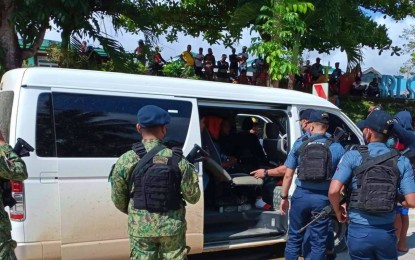 <p><strong>TIMELY RESCUE.</strong> Police officers of Lebak, Sultan Kudarat successfully rescue members of the Indigenous Peoples community (Dulangan Manobo tribe) from suspected human traffickers who would have brought them to Manila for employment, sans their parents’ approval, on Sunday (Nov. 8, 2022). The white van they were riding in was flagged down at a police border checkpoint in Barangay Christianuevo of the municipality.<em> (Photo courtesy of Lebak MPS)</em></p>