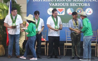 <p><strong>GOV’T ASSISTANCE</strong>. President Ferdinand R. Marcos Jr. (second from right) led the distribution of cash assistance to beneficiaries of the emergency employment program during a ceremony in Palo, Leyte on Tuesday (Nov. 8, 2022). Joining the President (L-R) are Tuingog Partylist Rep. Jude Acidre, Interior and Local Government Secretary Benhur Abalos, and Speaker Martin Romualdez. <em>(Photo courtesy of PRTV Tacloban)</em></p>