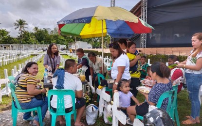 <p><strong>LETTING GO</strong>. The Sabido Family gathers at the grave of their clan who perished when Super Typhoon Yolanda struck in 2013 on Tuesday (Nov. 8, 2022). The mass grave is the burial place of over 2,000 victims of the country's strongest typhoon that struck the city exactly nine years ago. <em>(PNA photo by Sarwell Meniano)</em></p>