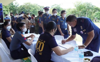 <p><strong>DRUG TEST.</strong> Personnel of the Police Regional Office in Bicol (PRO-5) undergo a surprise drug test initiated by Brig. Gen. Rudolph Dimas, PRO-5 director (right, standing) on Wednesday (Nov. 9, 2022). Lt. Col. Malu Calubaquib, PRO-5 spokesperson, said the regional headquarters conducted a simultaneous surprise random drug testing on both the uniformed and non-uniformed personnel. <em>(Photo courtesy of PRO-5)</em></p>
