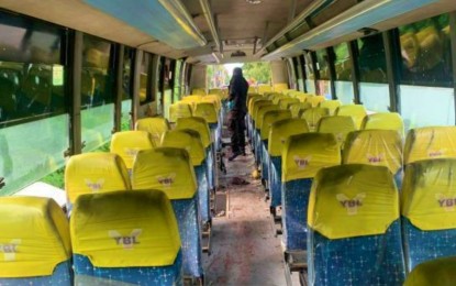 <p><strong>BLAST SCENE.</strong> A bomb expert sifts through empty bus chairs of the ill-fated Yellow Bus Lines unit in Tacurong City on Sunday (Nov. 6, 2022) that left one passenger dead and injured 11 others. Authorities tagged a blast victim who lost a leg in the incident as the primary suspect in the bomb attack. <em>(Photo courtesy of PRO-Soccsksargen)</em></p>