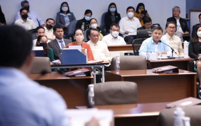 <p>BUDGET DEFENDED. Sen. Sonny Angara (sitting in blue long-sleeve polo), chair of the Committee on Finance, leads the deliberations on the proposed P5.268-trillion national budget for 2023 Thursday (November 10, 2022). Angara was able to defend the budget of the Office of the President amounting to PHP8.96 billion. <em>(Photo courtesy of Senate PRIB)</em></p>