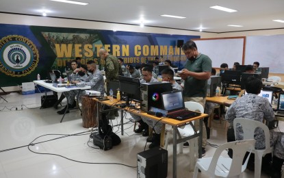 <p><strong>BOOSTING CYBER DEFENSE.</strong> Western Command (Wescom) personnel are seen here taking part in the ongoing cyber defense exercise which is one of the components of "DAGIT-PA" exercises of the Armed Forces of the Philippines on Wednesday (Nov. 9, 2022). Wescom chief Vice Adm. Alberto Carlos said the ongoing exercise would allow their cyber personnel to be highly proficient in warfighting functions in the cyberspace domain.<em> (Photo courtesy of Wescom)</em></p>