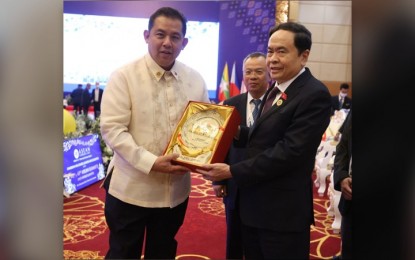 <p><strong>COUNTERPARTS.</strong> Vietnam National Assembly Chairman Vuong Dinh Hue gives Speaker Martin Romualdez a token of appreciation during a break at the Association of Southeast Asian Nations (ASEAN) Inter-Parliamentary Assembly (AIPA) meeting on Thursday (Nov. 10, 2022) at the Sokha Hotel in Phnom Penh, Cambodia. Chairman Hue is visiting the Philippines on Nov. 23 to 25, 2022 to enhance long-standing Philippine-Vietnam ties. <em>(Photo courtesy of the office of Speaker Romualdez)</em></p>