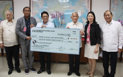 <p><strong>RELIEF AID.</strong> Taipei Economic and Cultural Office (TECO) representative Peiyung Hsu (3rd from right) turns over a ceremonial check worth USD400,000 (about PHP22.9 million) to Manila Economic and Cultural Office (MECO) chairperson and resident representative Silvestre Bello III (3rd from left) at the RCBC Plaza in Makati City on Friday (Nov. 11, 2022). The amount would be used to augment ongoing disaster relief efforts and humanitarian operations in areas in the provinces of Cagayan and Isabela that were severely affected by Severe Tropical Storm Paeng. <em>(PNA photo by Jess Escaros Jr.)</em></p>