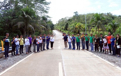 <p><strong>CONNECTIVITY.</strong> The Philippine Rural Development Program of the Department of Agriculture hands over to the Butuan government the completed PHP158.9 million farm-to-market road on Thursday (Nov. 10, 2022). The 9.8-kilometer road project directly benefits more than 1,000 farming families in Barangays Tungao and San Mateo, Butuan City. <em>(Photo courtesy of DA-13)</em></p>
