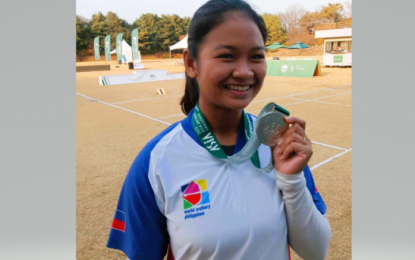 <p><strong>SILVER FINISH</strong>. Gabrielle Monica Bidaure shows the silver medal she won in the women's recurve event at the World Archery Asia Joint Training and Asia Archery Challenge in South Korea on Nov. 11, 2022. Nam Su Hyun Nam of Korea won the gold medal.<em> (Contributed photo)</em></p>