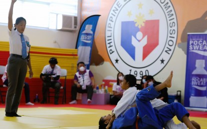 <p><strong>GOLDEN GIRL.</strong> Jhenica Raijah Serrano of Central Judo Club (in white) pins down Monique Viray of Valenzuela City Judo Club in the Under 40kg category of the 8th Women's Martial Arts Festival at the Judo Training Center inside the Rizal Memorial Sports Complex in Manila on Monday (Nov. 14, 2022). Serrano won via ippon. <em>(PNA photo by Jesus Escaros Jr.)</em></p>