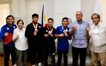 <p><strong>SPECIAL GUESTS.</strong> National boxers Hergie Bacyadan, Nesthy Petecio and Carlo Paalam (3rd to 5th from left) pay a courtesy call on Philippine Sports Commission officials at Rizal Memorial Sports Complex in Manila on Monday (Nov. 14, 2022). PSC Chair Noli Eala (6th from left) vows to support the boxers all the way to the 2024 Paris Olympics. <em>(Contributed photo)</em></p>