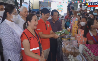 <p><strong>'KADIWA NG PASKO'.</strong> President Ferdinand R. Marcos Jr. takes a look at the different products being sold at the Kadiwa ng Pasko launch in Barangay Addition Hills in Mandaluyong City on Wednesday (Nov. 16, 2022). Marcos expressed hope that the grand opening of Kadiwa ng Pasko outlets in 14 areas nationwide would help ease the plight of Filipinos who have to bear the brunt of global challenges, including high inflation and soaring oil prices. <em>(Screenshot from RTVM)</em></p>