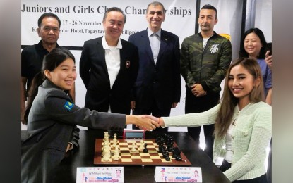<p><strong>ASIAN CHESS CHAMPIONSHIPS.  </strong>International Master Assel Serikbay of Kazkhstan (left), and Cavite Vice Governor Athena Bryana Tolentino shake hands before making the ceremonial first moves during the opening of the Asian Juniors and Girls Chess Championships at the Knights Templar Hotel in Tagaytay City on Friday (Nov. 18, 2022). Looking on are Philippine Olympic Committee president and Tagaytay City Mayor Abraham Tolentino (third from left), Asian Chess Federation Executive Board member Mehrdad Pahlevanzadeh, and the Appeals Committee members from India, Guam, Iran, Malaysia and Kazakhstan. <em>(Contributed photo) </em></p>