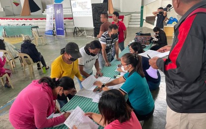 <p><strong>LIVELIHOOD AID</strong>. Residents of Ayungon town, Negros Oriental province line up to receive livelihood kits from the Department of Trade and Industry on Friday (Nov. 18, 2022). The beneficiaries were among those affected by Typhoon Odette in December 2021. <em>(Photo courtesy of DTI-Negros Oriental)</em></p>