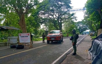 <p><strong>ANTI-CRIME OPERATION</strong>. Police officers in Datu Odin Sinsuat, Maguindanao, conduct anti-criminality operations along the highway in Barangay Dalican, Datu Odin Sinsuat, Maguindanao del Norte. Police and military personnel manning the same checkpoint on Sunday (Nov. 20, 2022) arrested a man whose vehicle yielded high-powered firearms and ammunition.<em> (Photo courtesy of Maguindanao PPO)</em></p>