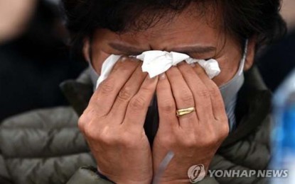<p><strong>CALLS FOR PUNISHMENT</strong>. A family member of an Itaewon crowd crush victim wipes away tears during a news conference in southern Seoul on Tuesday (Nov. 22, 2022). The bereaved families of some of the victims called for the punishment of those responsible for the tragic accident. <em>(Pool photo) (Yonhap)</em></p>