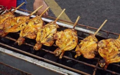 <p><strong>FIFTH BEST CHICKEN DISH IN THE WORLD</strong>. The famous chicken inasal of Bacolod City being grilled during the 2nd Chicken Inasal Festival in May 2019. In October, online food critic TasteAtlas.com ranked chicken inasal as the fifth best chicken dish in the world, describing it as a “unique Filipino grilled chicken which originated in Bacolod City and became the signature dish of the entire Visayas region”.<em> (File photo from Bacolod City PIO)</em></p>