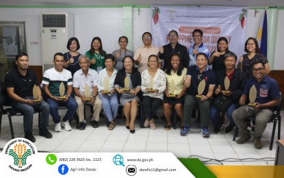<p><strong>CACAO CHAMPS.</strong> Officials from the Department of Agriculture in Davao Region (DA-11) pose with the 10 cacao farmers who were recognized on Tuesday (Nov. 22, 2022) for having the best quality cacao beans in the region during a gathering held at the DA-11 office in Davao City. The winners will have the chance to showcase the quality of their produce at the national level on Nov. 24-25, 2022 for a chance to represent the country at the Salon du Chocolat in Paris, the biggest international annual trade fair for cocoa and the chocolate industry. <em>(Photo courtesy of DA-11)]</em></p>