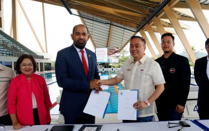 <p><strong>HOSTING.</strong> Philippine Olympic Committee (POC) President Rep. Abraham “Bambol” Tolentino (fourth from left) and Asia Swimming Federation Secretary General Taha Suleiman Al Kishry shake hands after signing the memorandum of agreement at the New Clark City Aquatic Center in Capas, Tarlac on Wednesday (Nov. 23, 2022). The Philippines will host the 11th Asian Age Group Swimming Championships in November next year. (Photo courtesy of POC)</p>
<p> </p>