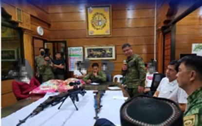 <p><strong>DEACTIVATED GUNS.</strong> The three high-powered firearms of three surrendering Bangsamoro Islamic Freedom Fighters (BIFF) were presented to Mayor Sumulong Sultan (2nd from right) of Pikit, North Cotabato on Wednesday (Nov. 23, 2022). The surrenderers said they gave up on the BIFF struggle after realizing that it was getting nowhere. <em>(Photo courtesy of PRO-12) </em></p>