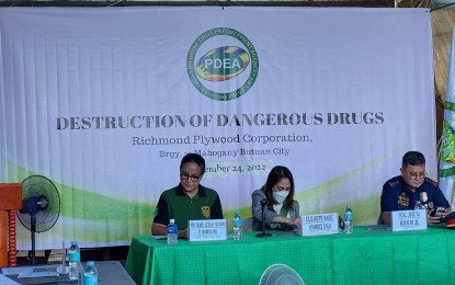 <p><strong>UP IN SMOKE</strong>. PDEA-13 Assistant Regional Director Mary Leslie Sharon Maquilang (left), together with Agusan del Norte Provincial Administrator Elizabeth Marie Ramirez (center), and Col. Jose Manalad Jr. of the Police Regional Office in the Caraga Region lead the destruction of confiscated dangerous drugs on Thursday (Nov. 24, 2022) at the Richmond Plywood Corporation in Purok 1, Barangay Mahogany, Butuan City. A total of PHP29.8 million worth of illegal drugs were burned during the activity. <em>(Photo courtesy of PDEA-13) </em></p>