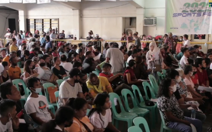 <p><strong>CALAMITY VICTIMS</strong>. Residents of Cagayan de Oro City wait for the distribution of cash assistance at the city hall grounds on Thursday (Nov. 24, 2022). The recipients came from six villages that were affected by the recent flooding and fire in the city. <em>(Image courtesy of City Mayor's Office) </em></p>