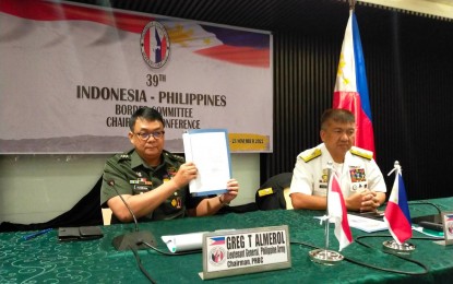 <p><strong>STRONGER TIES.</strong> Lt. Gen. Greg Almerol, the commander of the Eastern Mindanao Command and chairman of the Philippine Border Committee (left) signs the 12 proposed agenda items that were adopted during the 39th Indonesia-Philippines Border Committee Chairmen’s Conference held in Davao City on Wednesday (Nov. 23, 2022). Along with Rear Admiral TNI Dr. TSNB Hutabarat, MMS, the commander of the Indonesian Military Command II, the parties expect the further enhancement of the 1975 Border Patrol and Border Crossing Agreements between the two countries.<strong> </strong><em>(PNA photo byRobinson Niñal Jr.) </em></p>